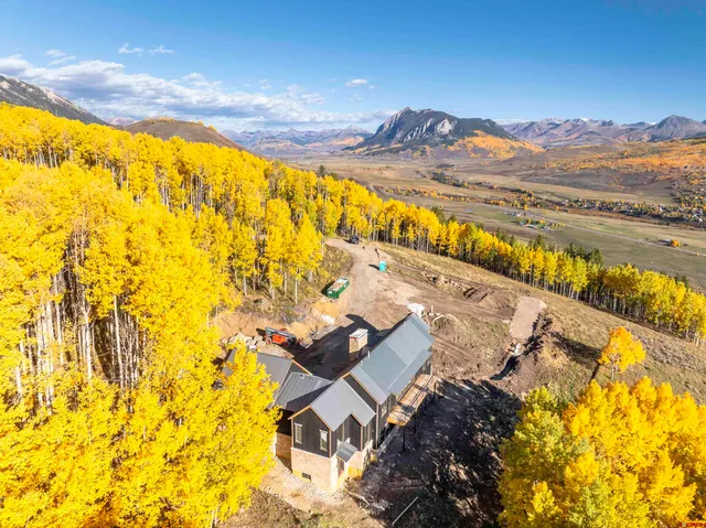 a view of an ocean and a mountain