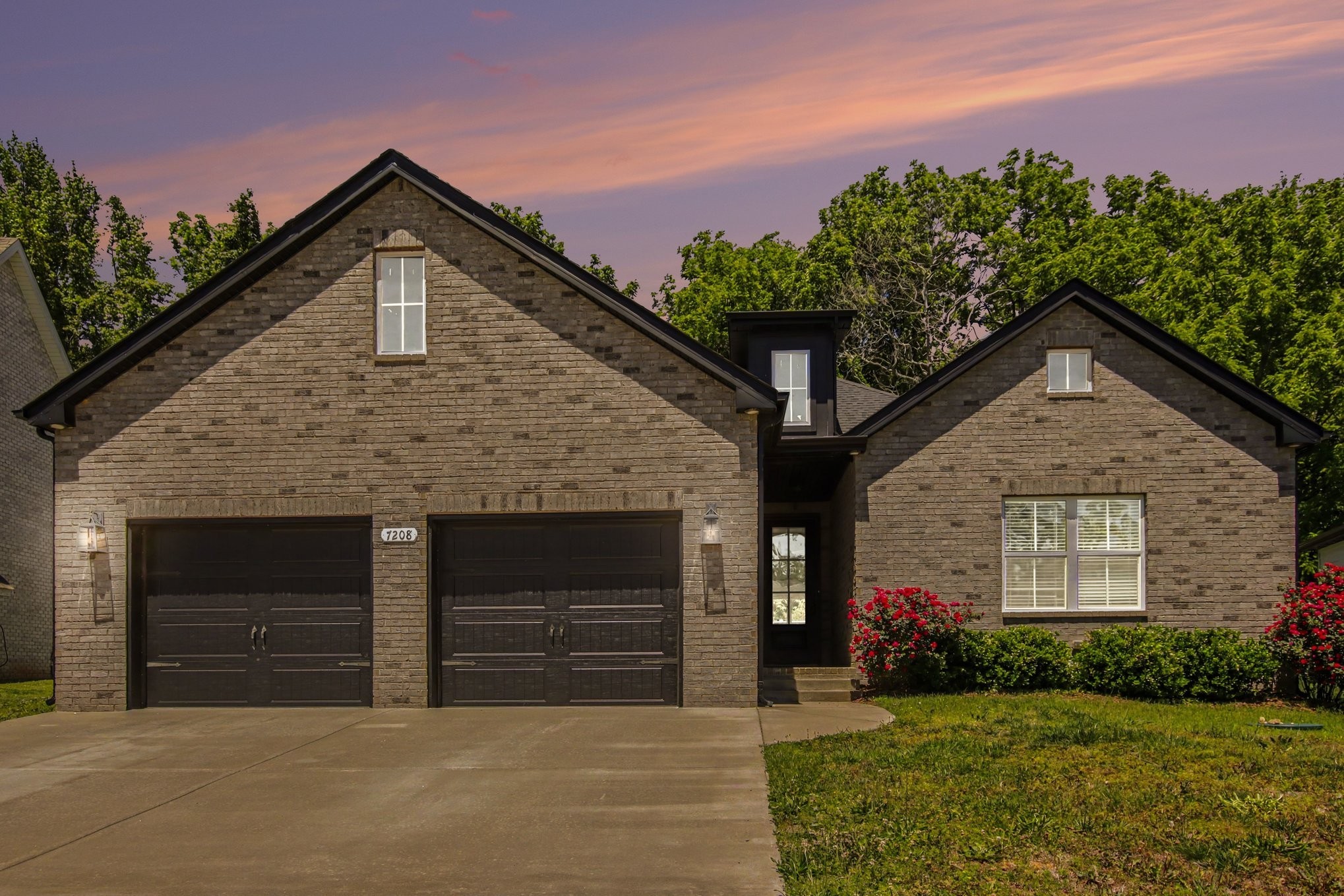 7208 Winding Way Pleasant View, TN 37146 - Photo 29 of 30 a front view of a house with a yard and garage