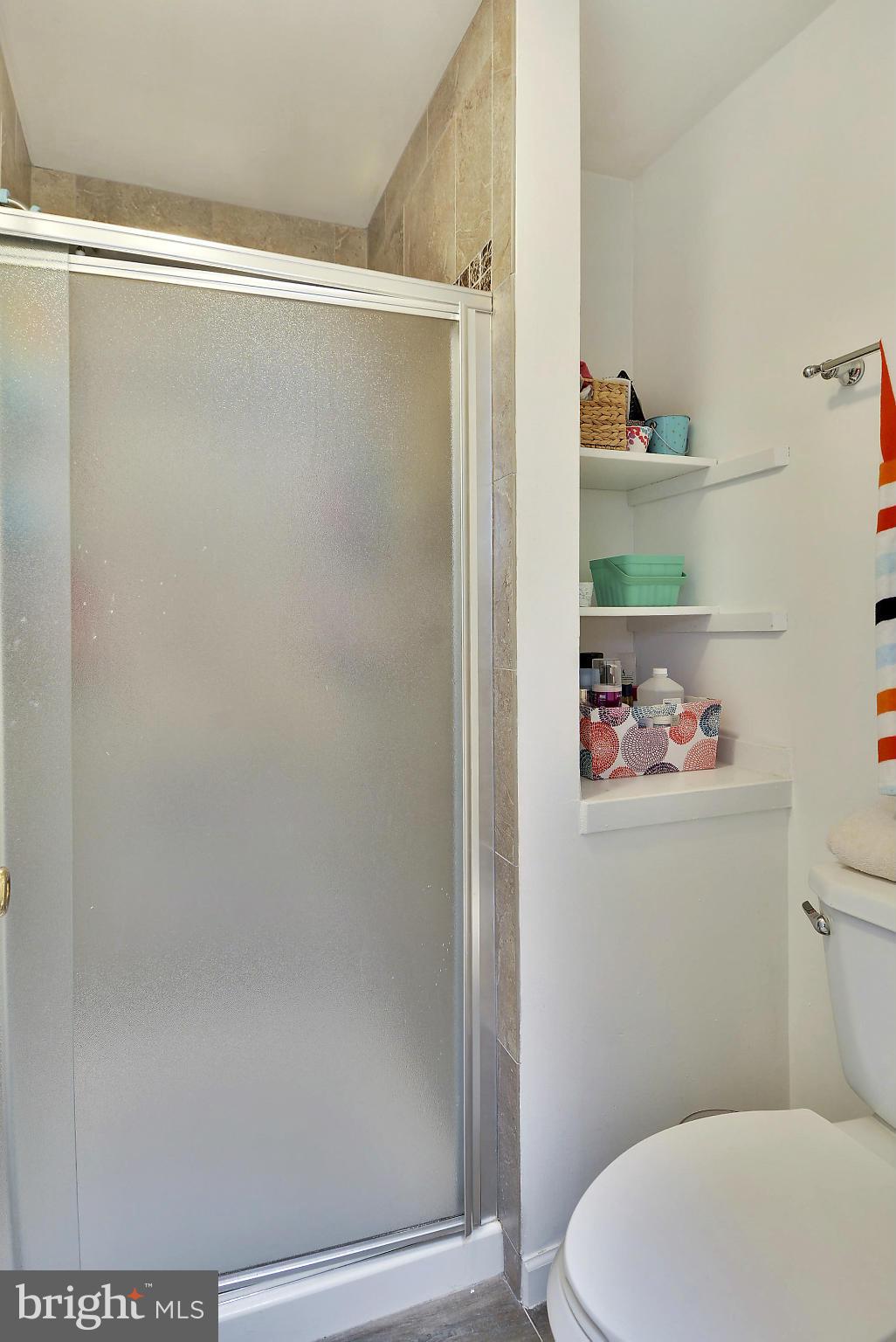 141 Annandale Road Falls Church, VA 22046 - Photo 11 of 30 a bathroom with a shower a toilet and sink