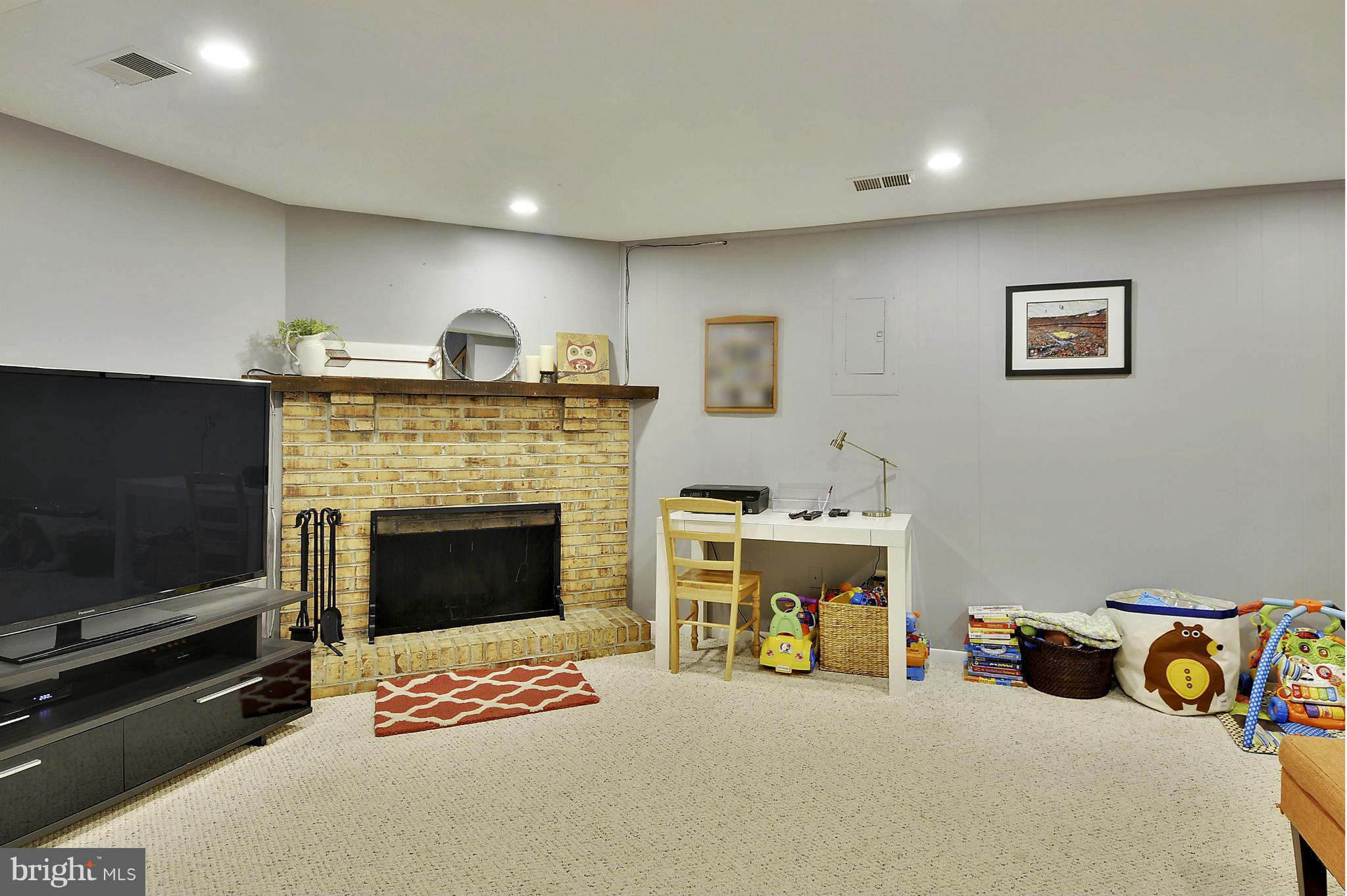 141 Annandale Road Falls Church, VA 22046 - Photo 16 of 30 a bedroom with furniture and a fireplace