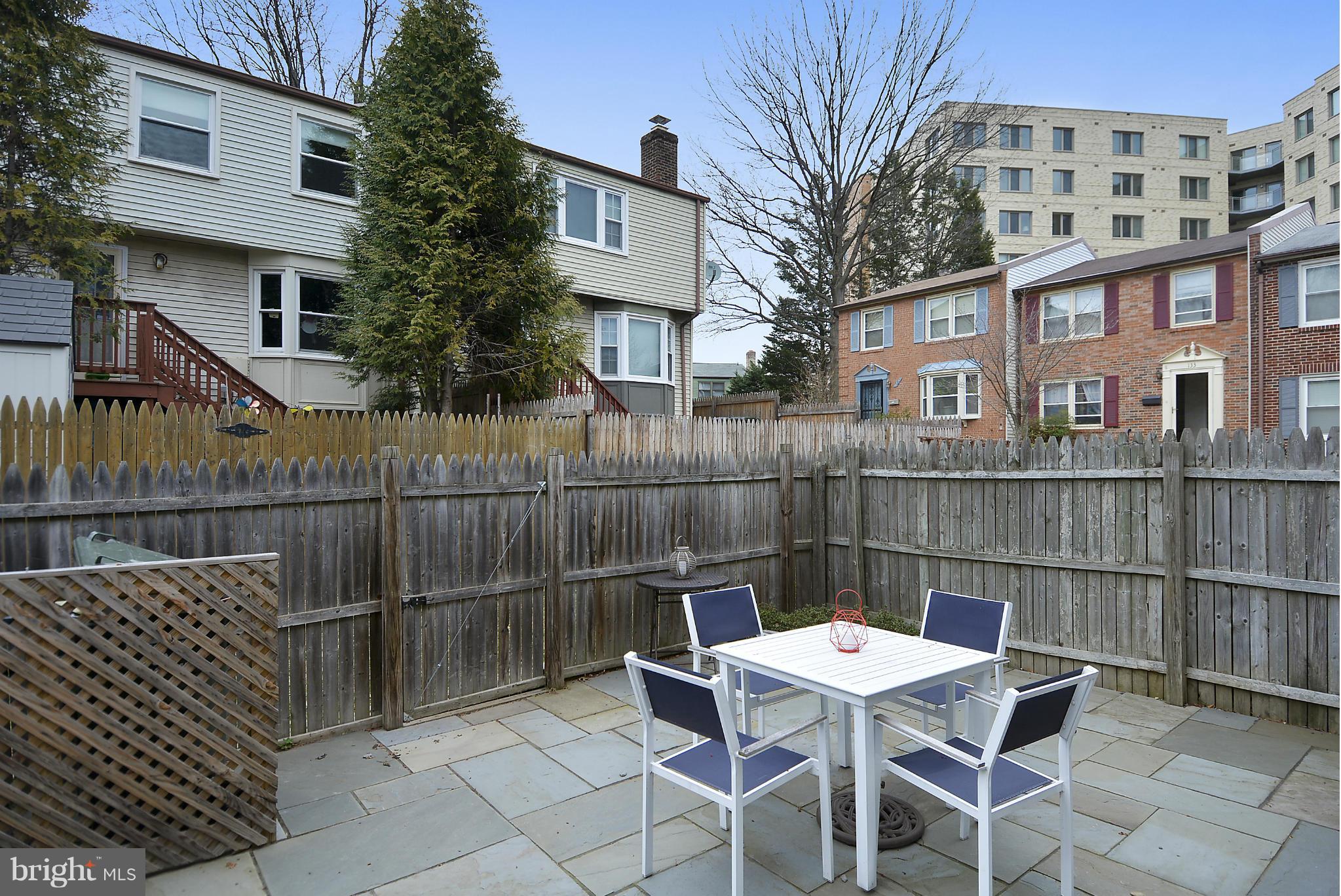 141 Annandale Road Falls Church, VA 22046 - Photo 17 of 30 a view of a chairs and table in the back yard of the house