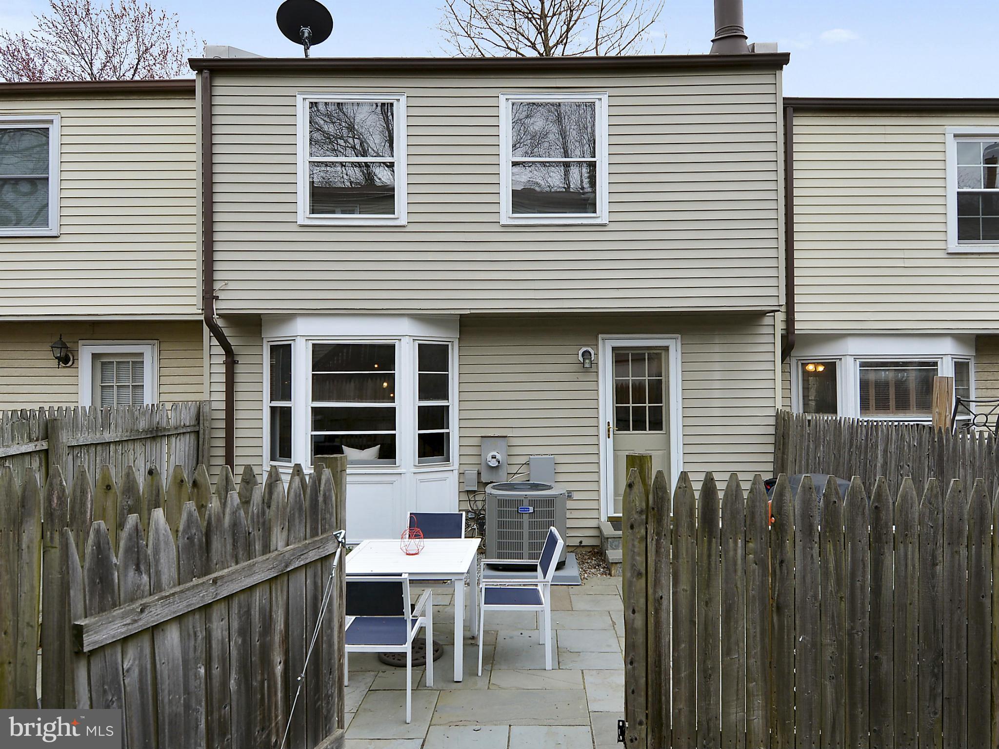 141 Annandale Road Falls Church, VA 22046 - Photo 19 of 30 a view of a house with a chairs in patio