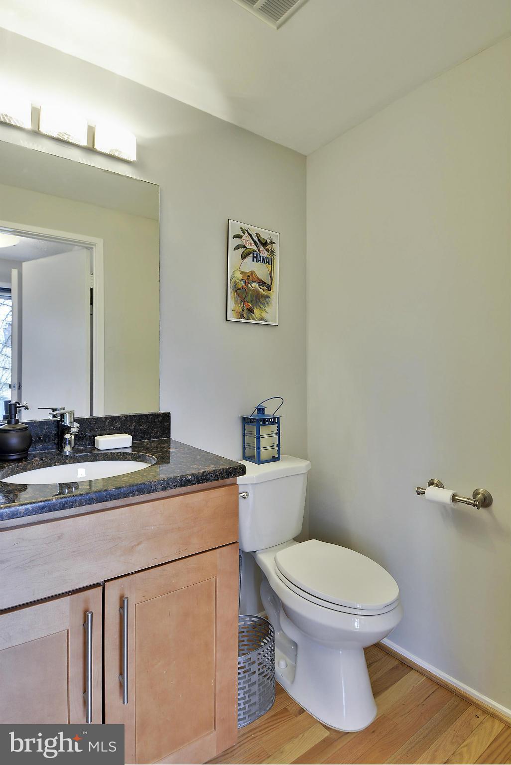 141 Annandale Road Falls Church, VA 22046 - Photo 8 of 30 a bathroom with a granite countertop toilet sink and mirror