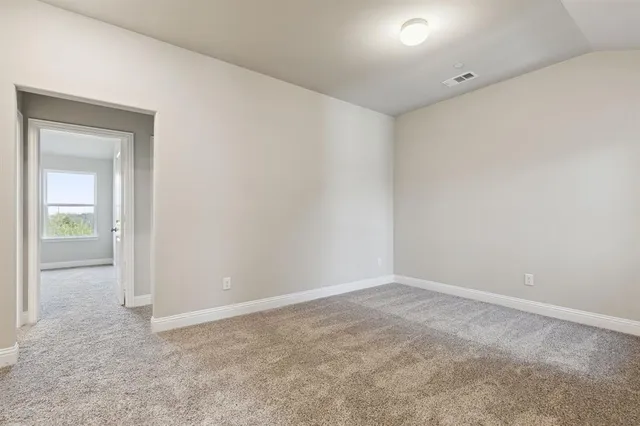 a view of an empty room and closet