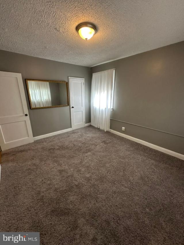 1619 Inverness Avenue Baltimore, MD 21230 - Photo 18 of 30 an empty room with stairs and windows