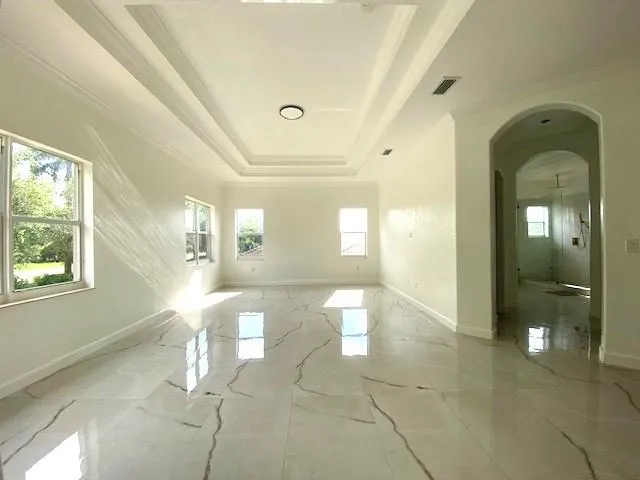 a view of a bathroom with a bathtub and shower