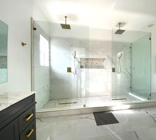 a bathroom with a bathtub and shower