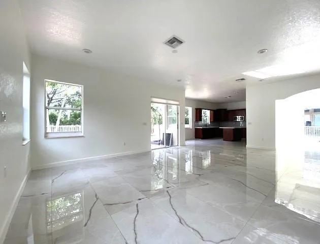 a view of livingroom with furniture and window