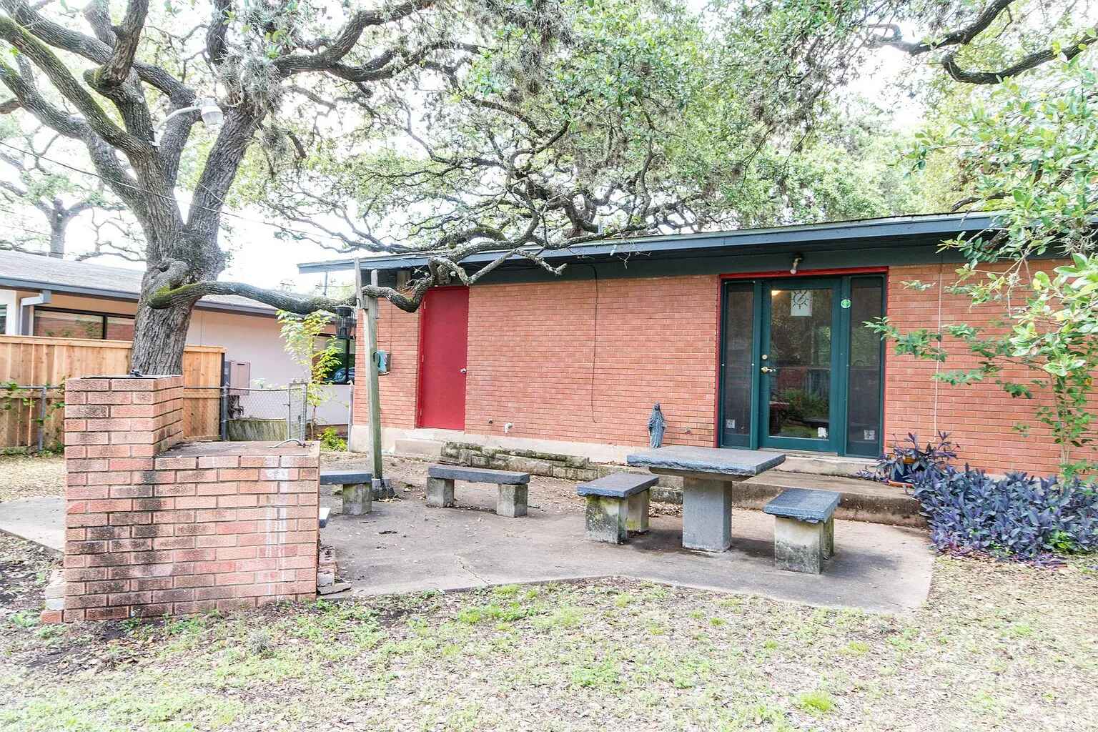 1207 Fieldcrest Drive Austin, TX 78704 - Photo 13 of 13 a backyard of a house with outdoor seating