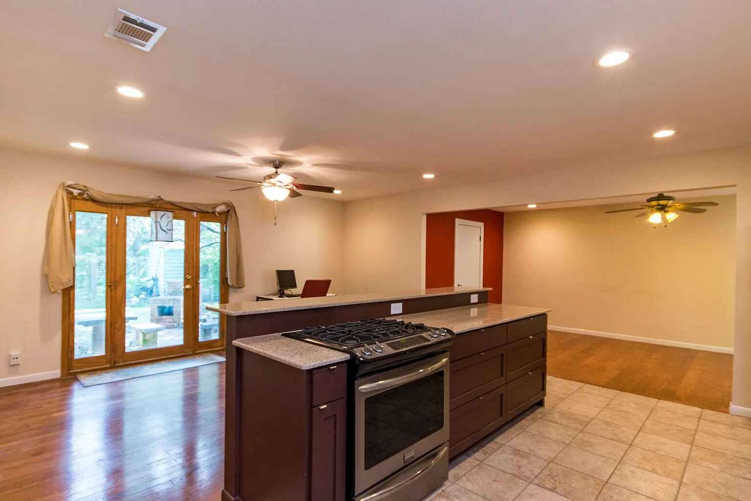 1207 Fieldcrest Drive Austin, TX 78704 - Photo 2 of 13 a kitchen that has a stove and a wooden floor