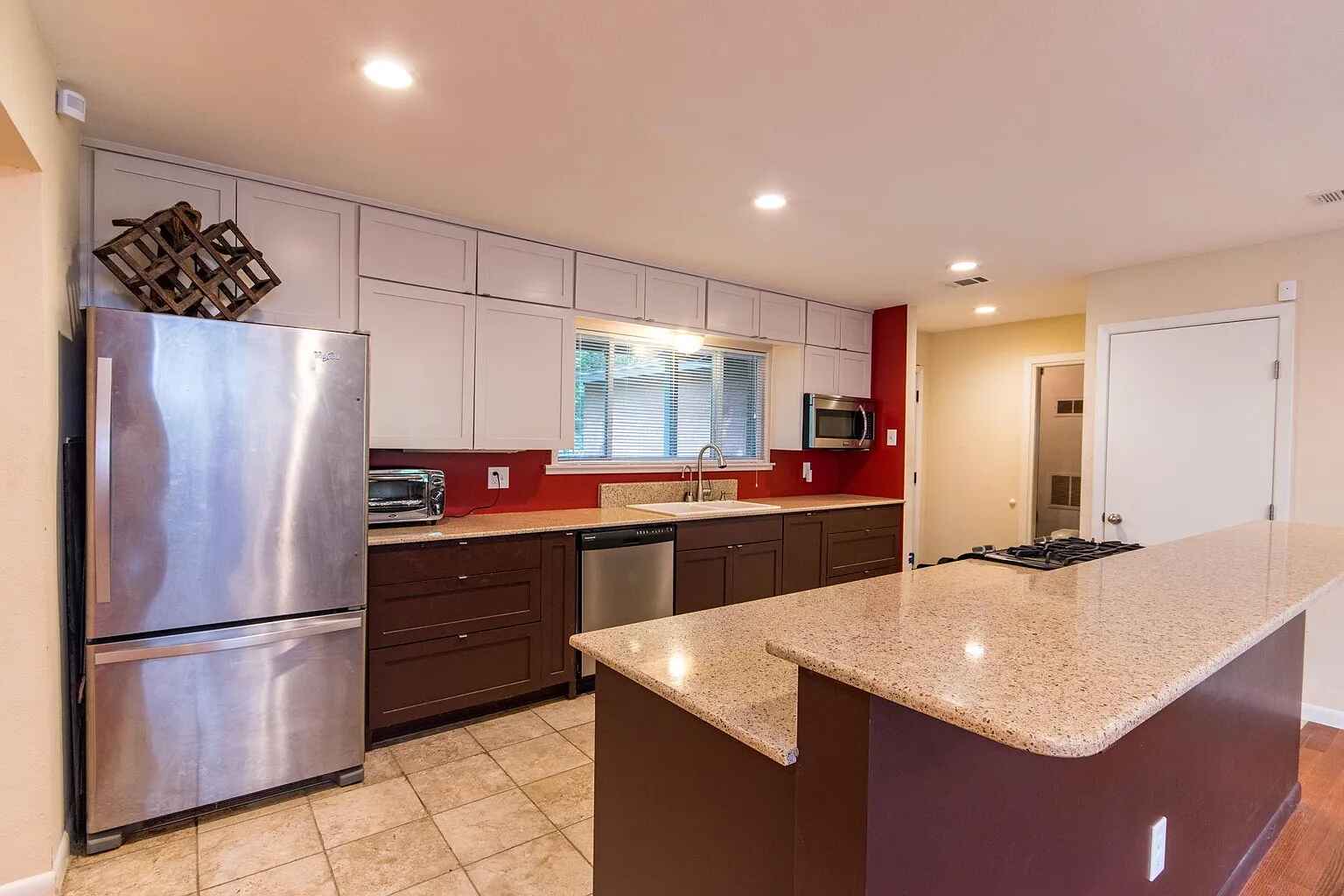1207 Fieldcrest Drive Austin, TX 78704 - Photo 3 of 13 a kitchen with stainless steel appliances granite countertop a refrigerator a sink and a refrigerator