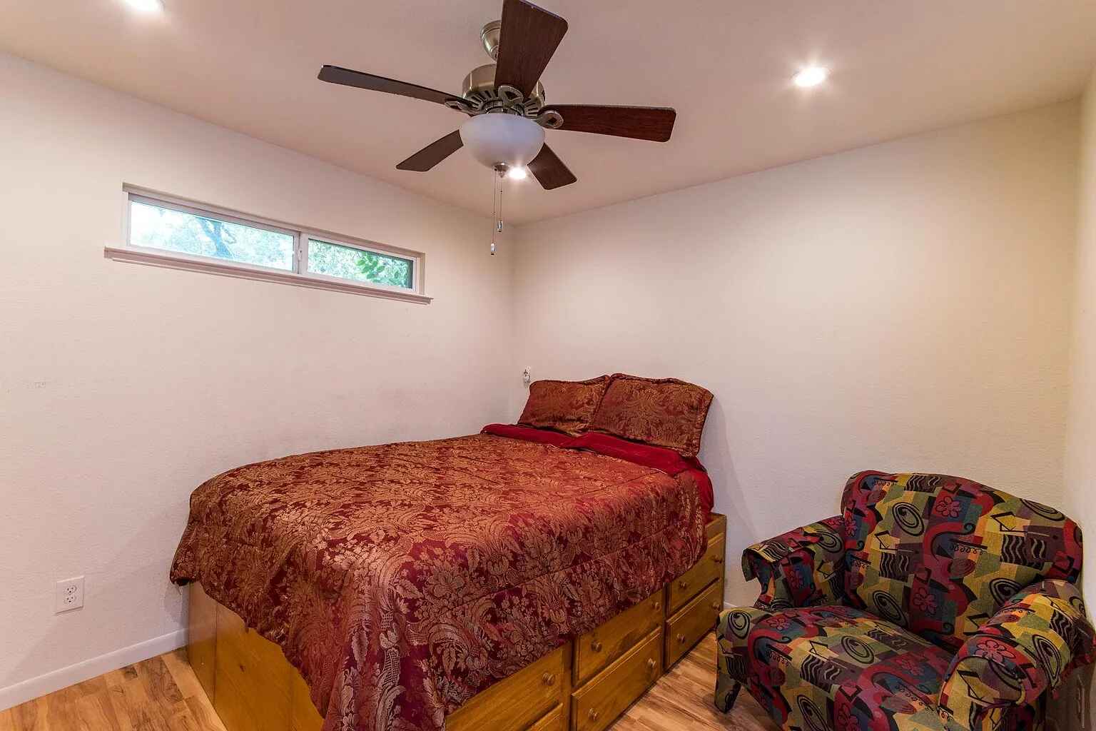 1207 Fieldcrest Drive Austin, TX 78704 - Photo 7 of 13 a bed sitting in a bedroom next to a window