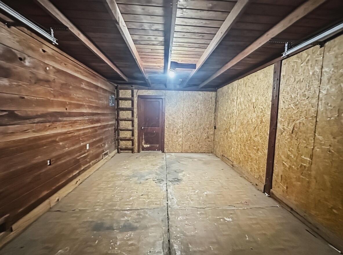 506 Northwest 4th Street Tulia, TX 79088 - Photo 30 of 30 a view of empty room with wooden walls
