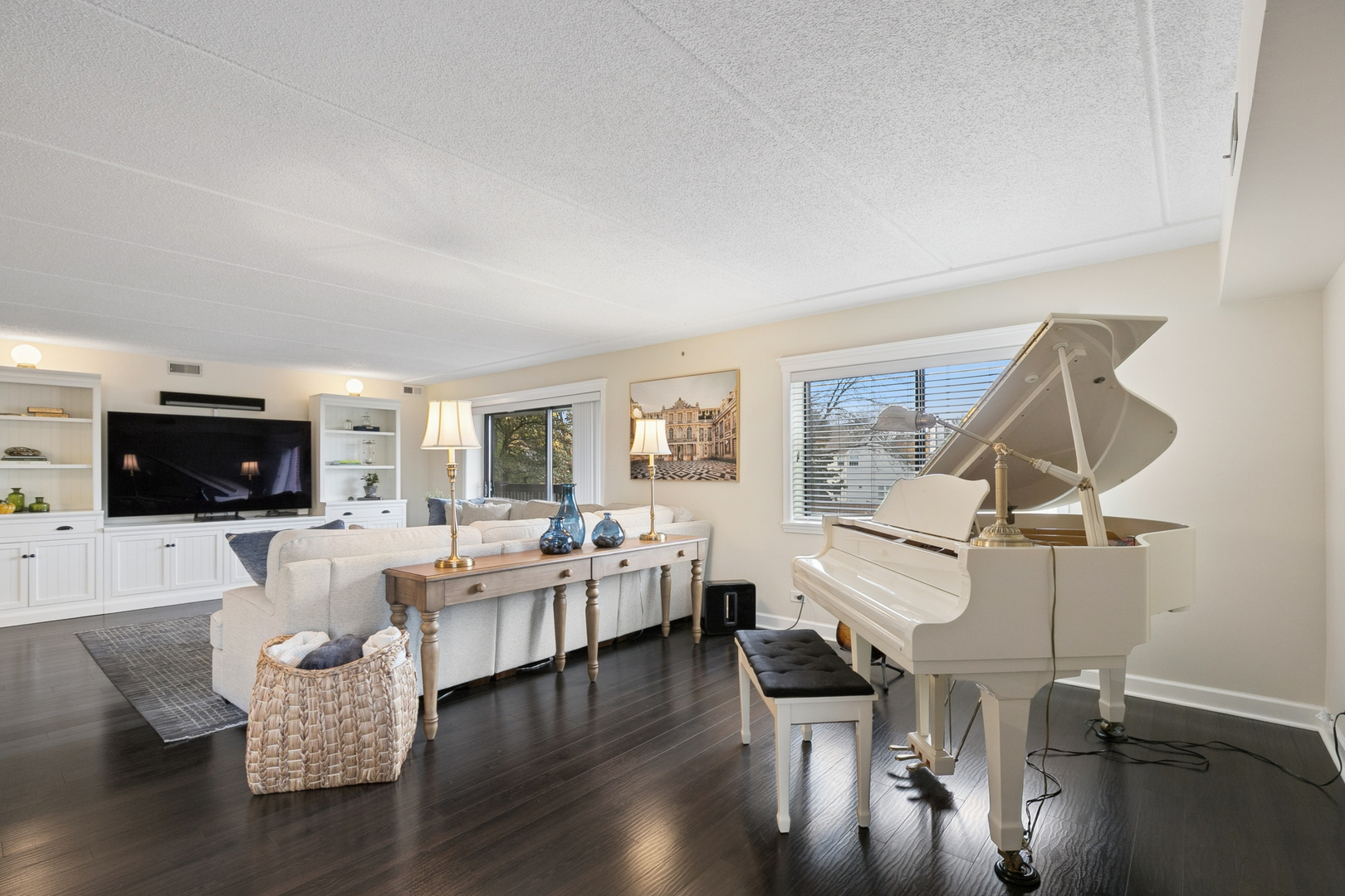 920 Vose Drive, Unit 202 Gurnee, IL 60031 - Photo 6 of 21 a living room with fireplace furniture and a flat screen tv