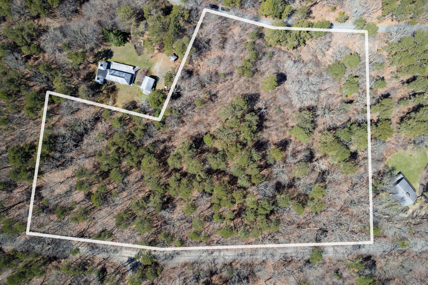 37 Bijah's Way Chilmark, MA 02535 - Photo 10 of 12 an aerial view of a house with a yard and large trees