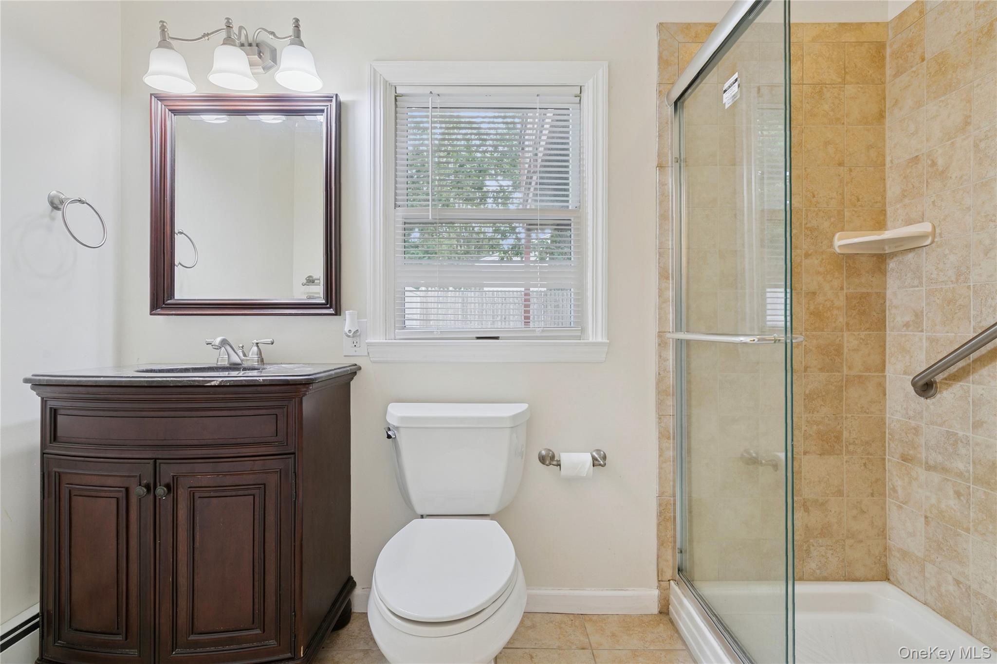 308 Browns Road Nesconset, NY 11767 - Photo 16 of 34 a bathroom with a toilet a sink and mirror