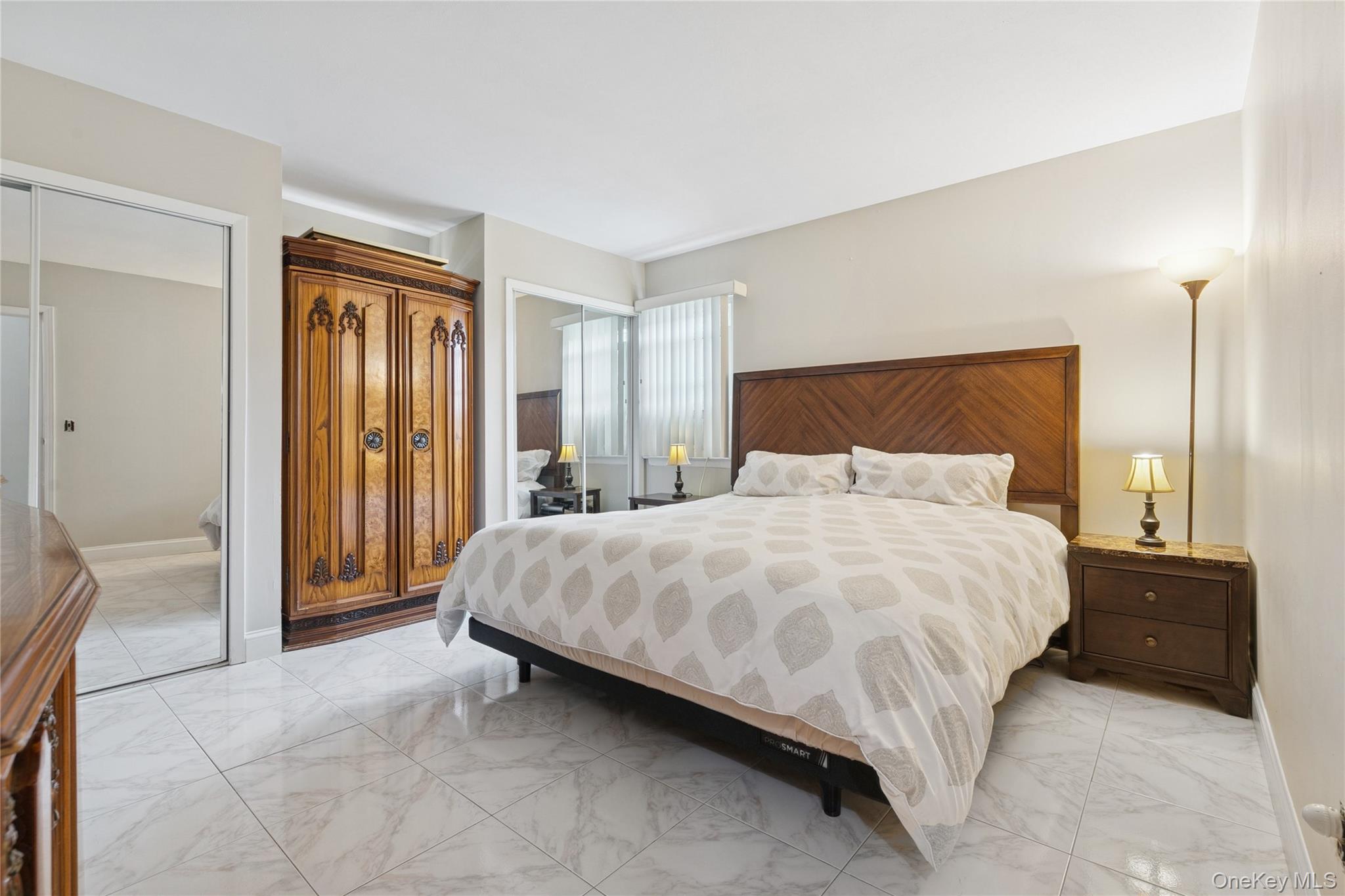 308 Browns Road Nesconset, NY 11767 - Photo 17 of 34 a bedroom with a bed and a cabinets