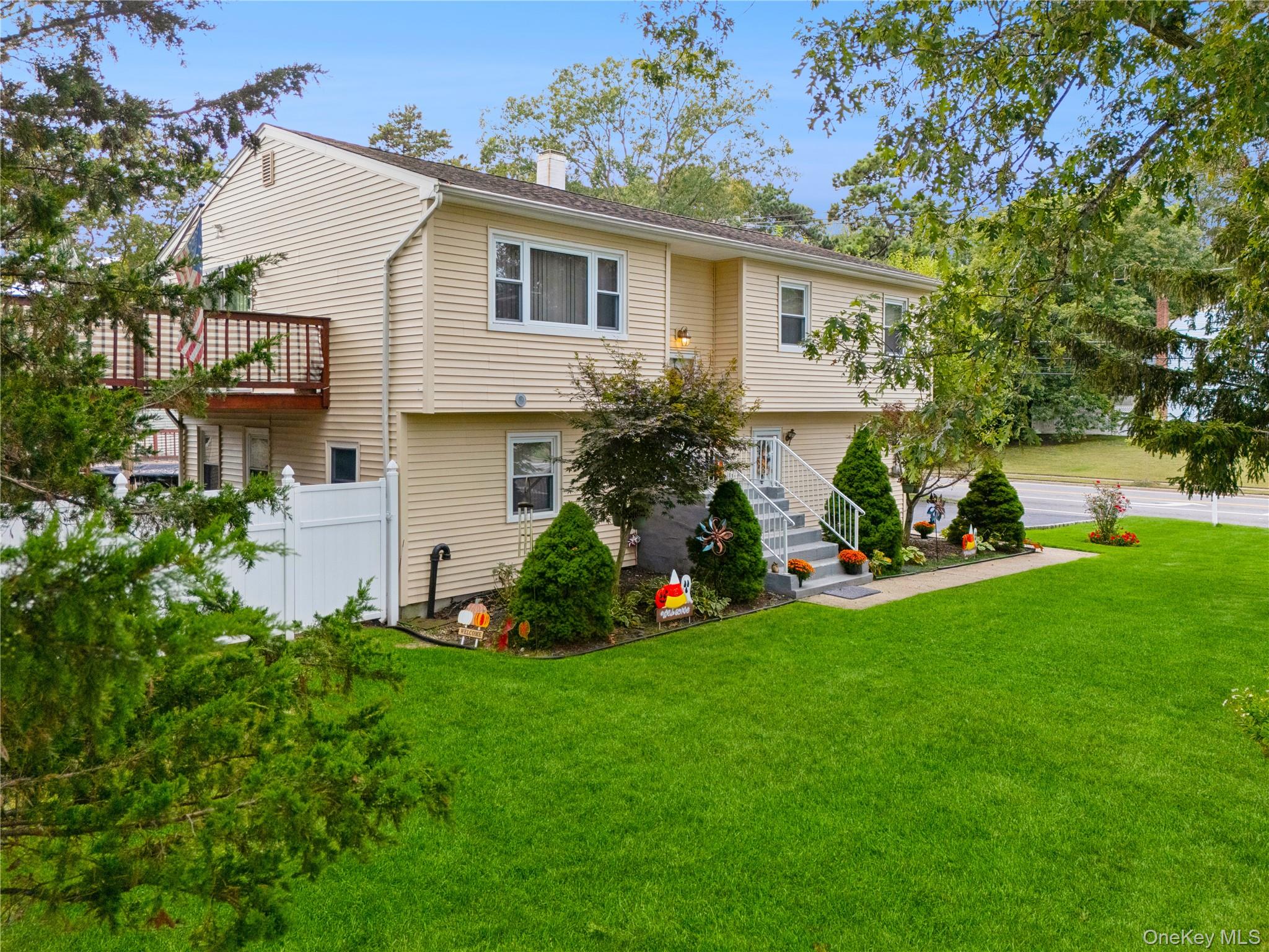 308 Browns Road Nesconset, NY 11767 - Photo 30 of 34 a front view of house with yard and green space