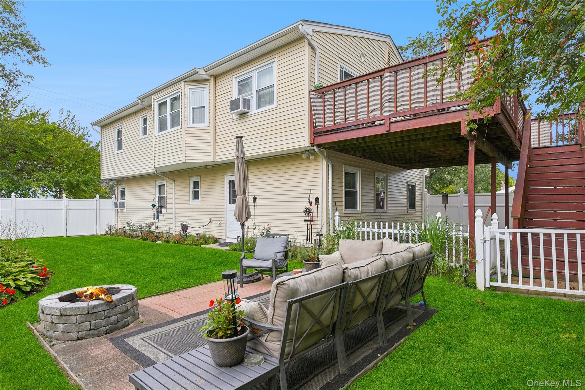 308 Browns Road Nesconset, NY 11767 - Photo 3 of 34 a front view of a house with garden