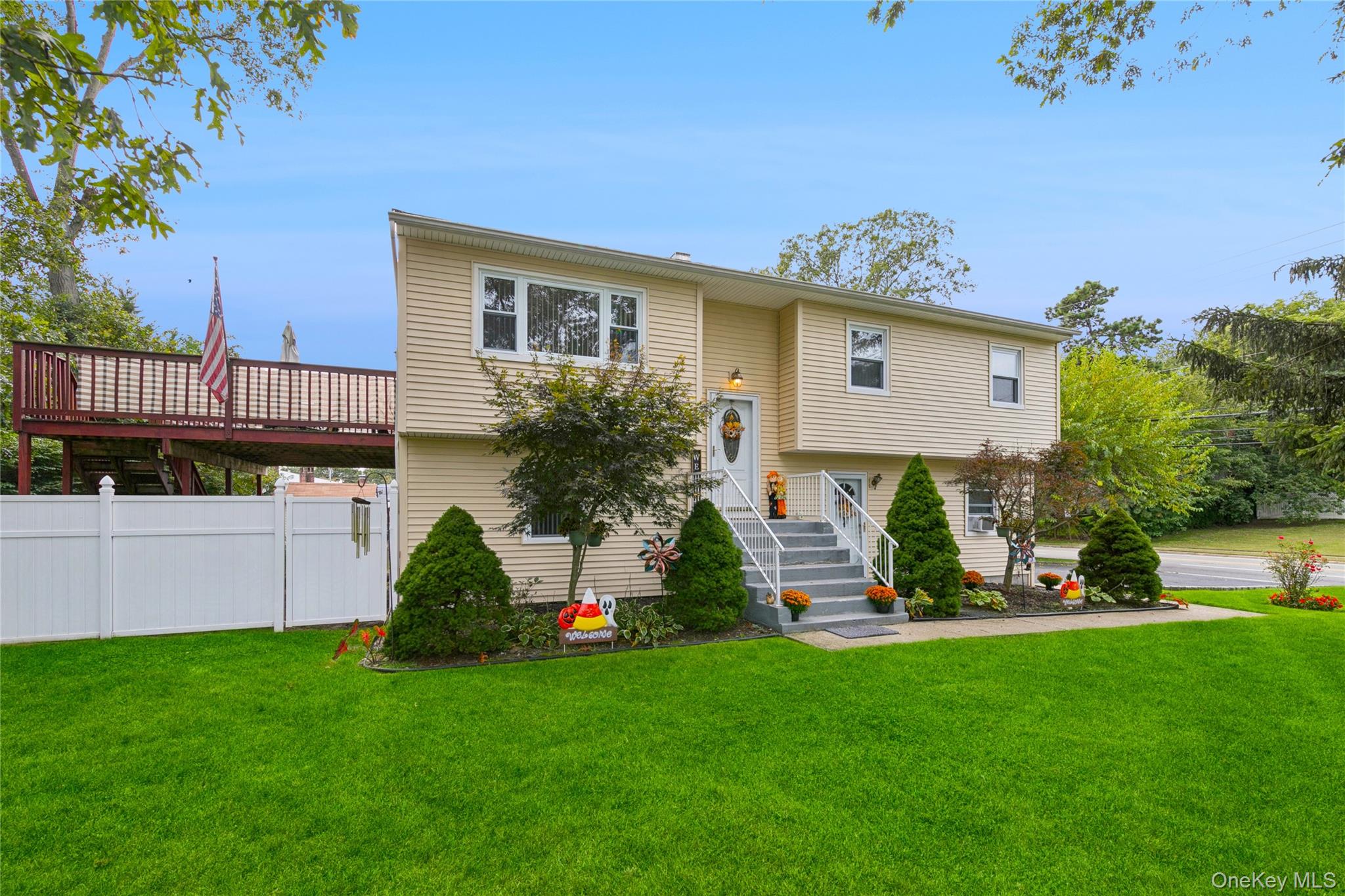 308 Browns Road Nesconset, NY 11767 - Photo 31 of 34 a front view of a house with a garden and plants