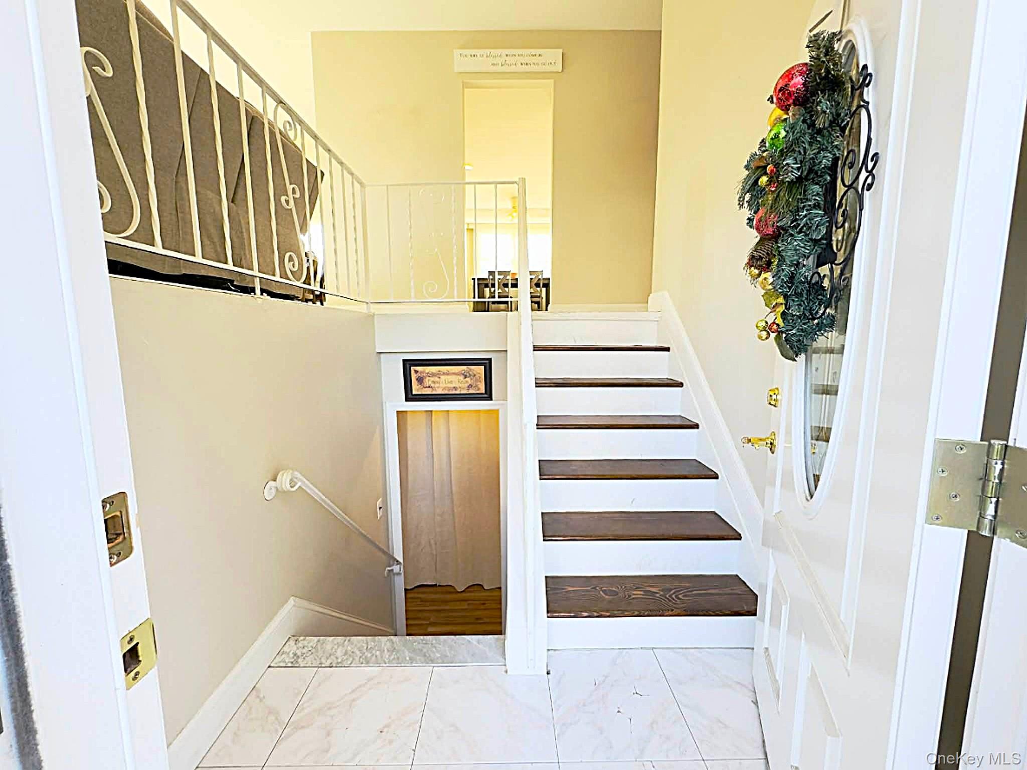 308 Browns Road Nesconset, NY 11767 - Photo 8 of 34 Staircase featuring marble look tile flooring and baseboards