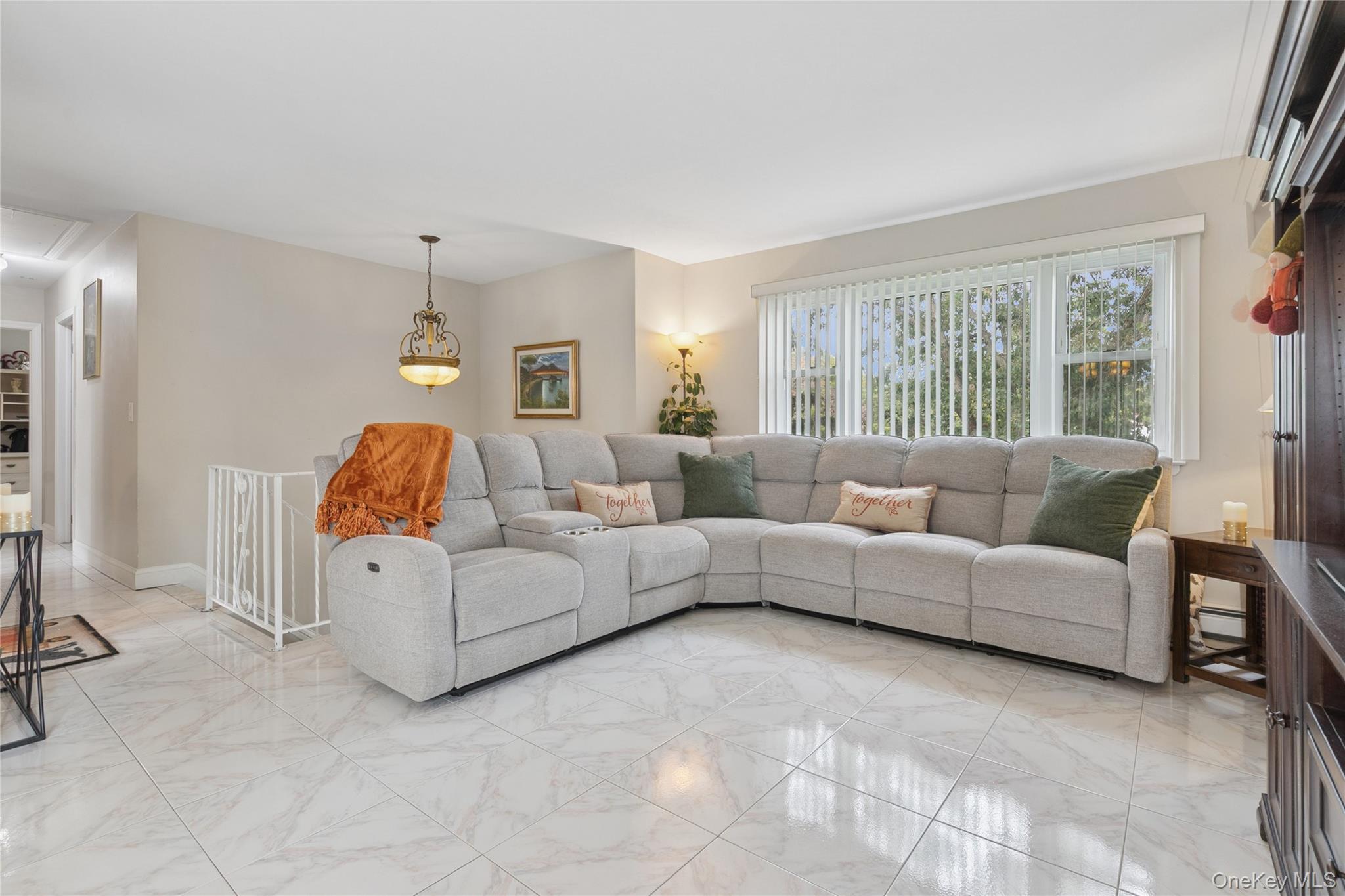 308 Browns Road Nesconset, NY 11767 - Photo 9 of 34 a living room with furniture and a large window