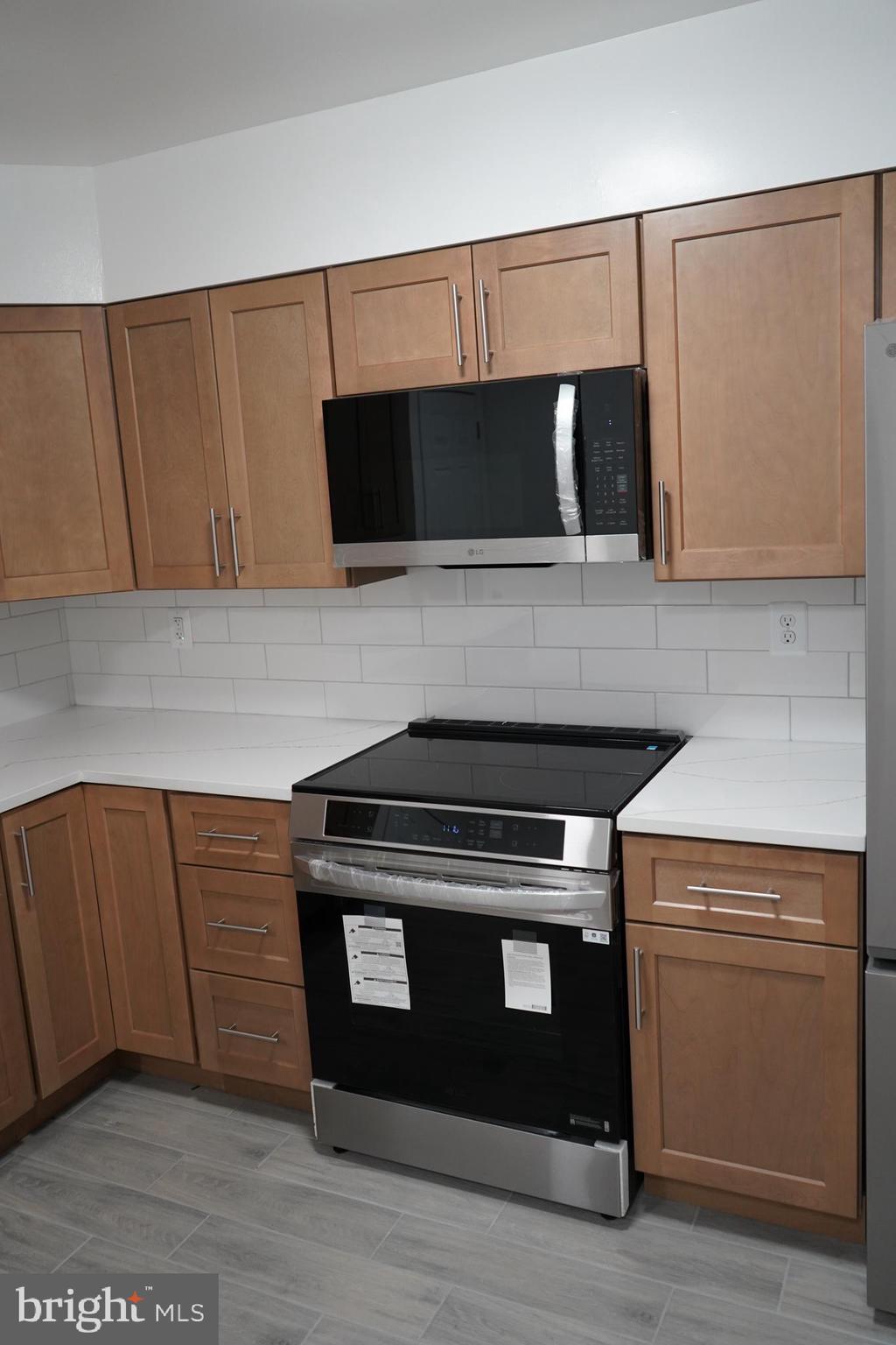 802 West Barre Street Baltimore, MD 21230 - Photo 12 of 72 a stove top oven sitting inside of a kitchen