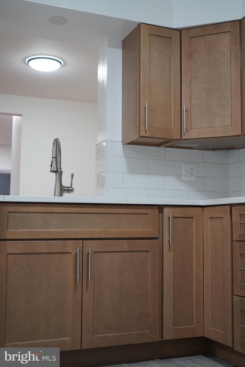 802 West Barre Street Baltimore, MD 21230 - Photo 15 of 72 a kitchen with granite countertop cabinets and white countertops