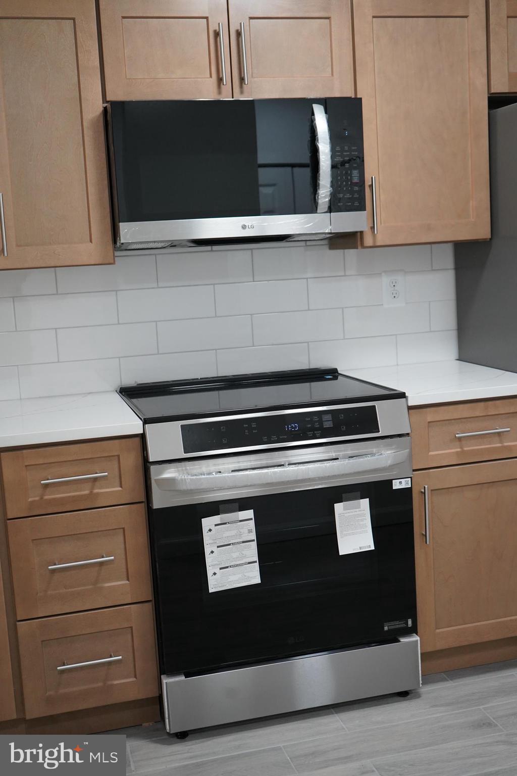 802 West Barre Street Baltimore, MD 21230 - Photo 17 of 72 a stove top oven sitting inside of a kitchen