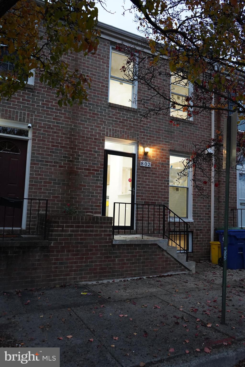 802 West Barre Street Baltimore, MD 21230 - Photo 2 of 72 a front view of a house with a yard