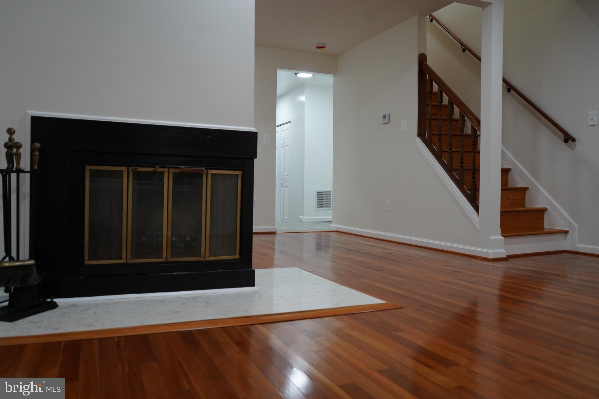 802 West Barre Street Baltimore, MD 21230 - Photo 26 of 72 an entryway with wooden floor and door