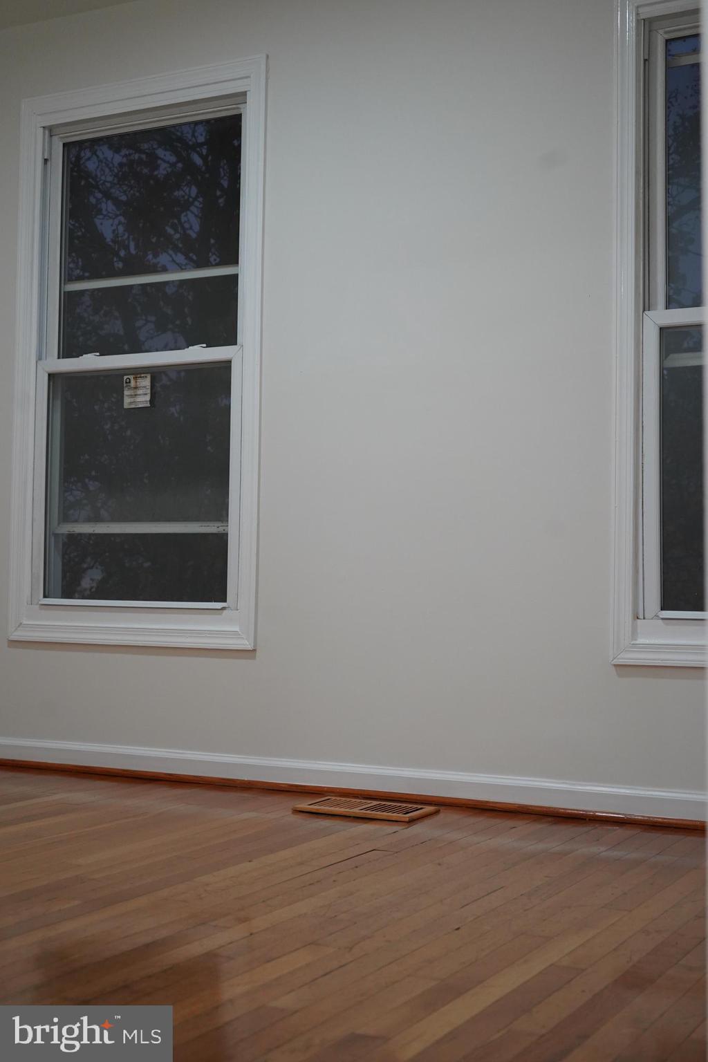 802 West Barre Street Baltimore, MD 21230 - Photo 35 of 72 a view of a small space with wooden floor and a window