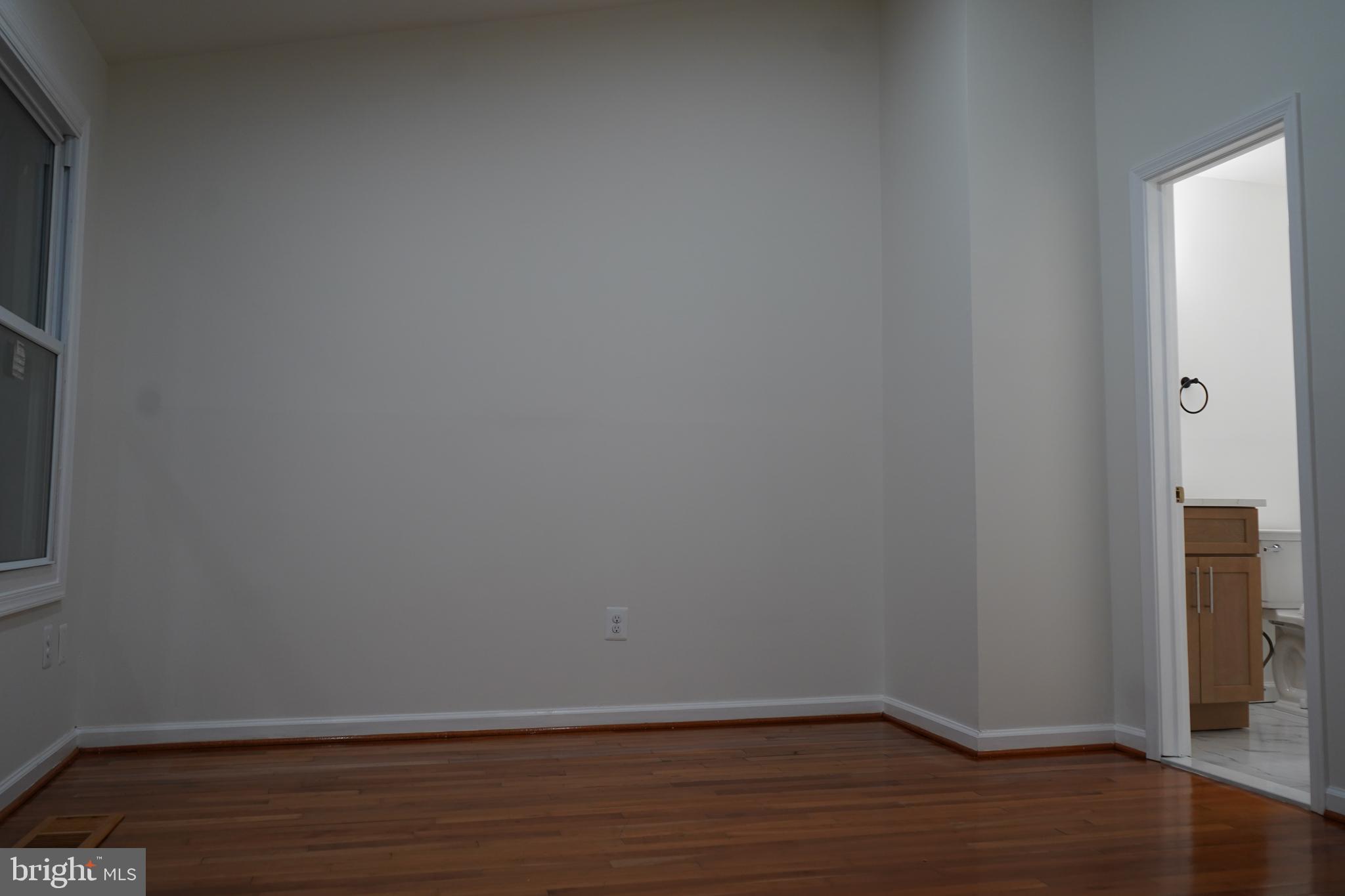 802 West Barre Street Baltimore, MD 21230 - Photo 44 of 72 a view of an empty room with wooden floor