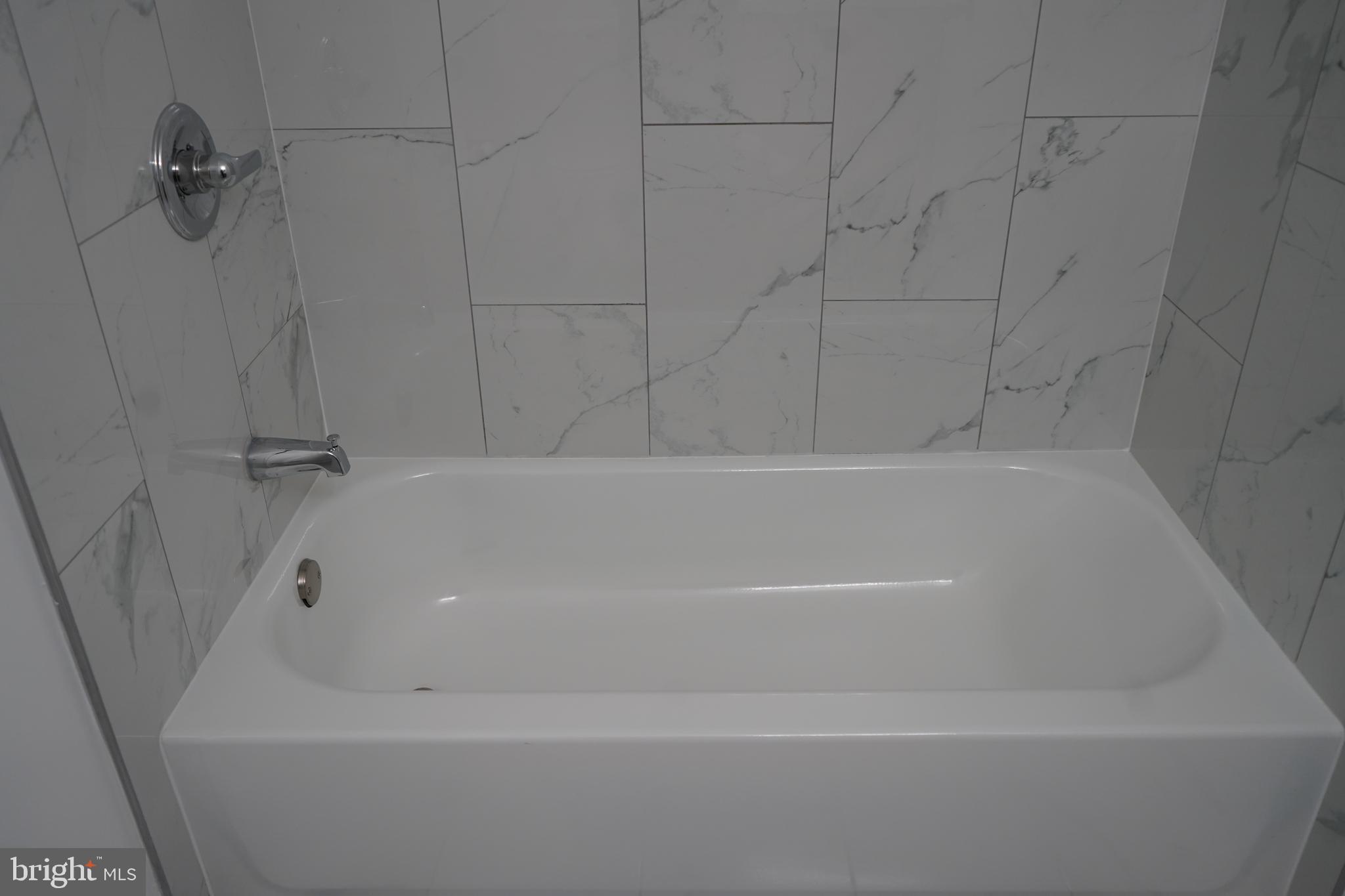 802 West Barre Street Baltimore, MD 21230 - Photo 49 of 72 a bathroom with a bathtub