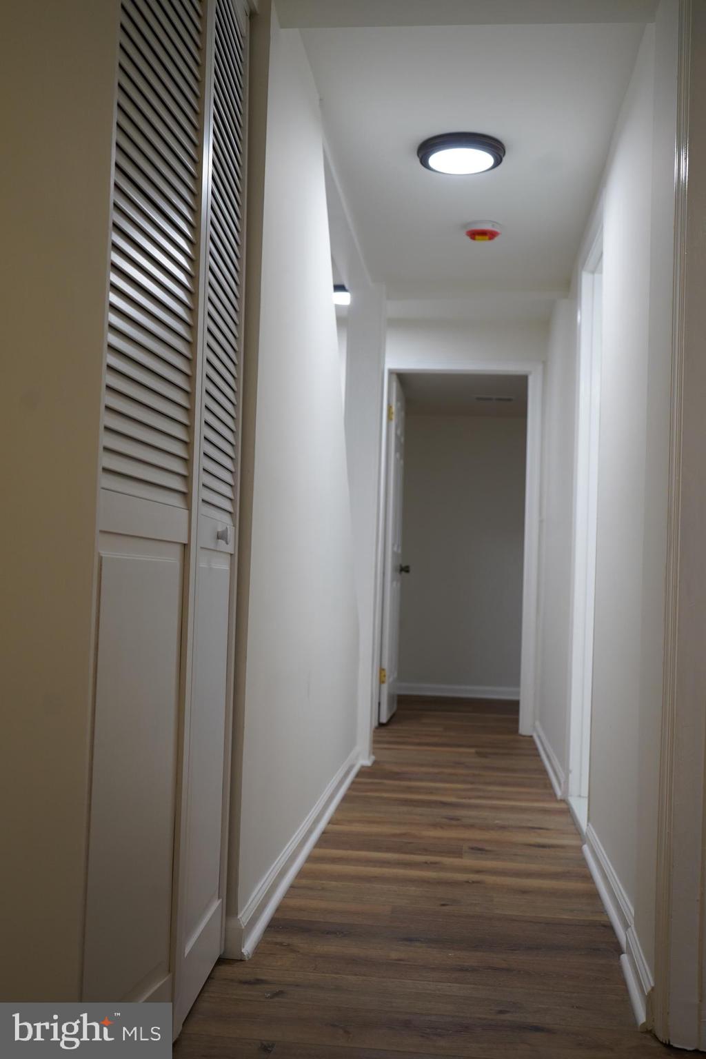 802 West Barre Street Baltimore, MD 21230 - Photo 63 of 72 a view of a hallway with wooden floor