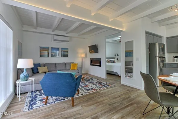 a living room with furniture and a rug