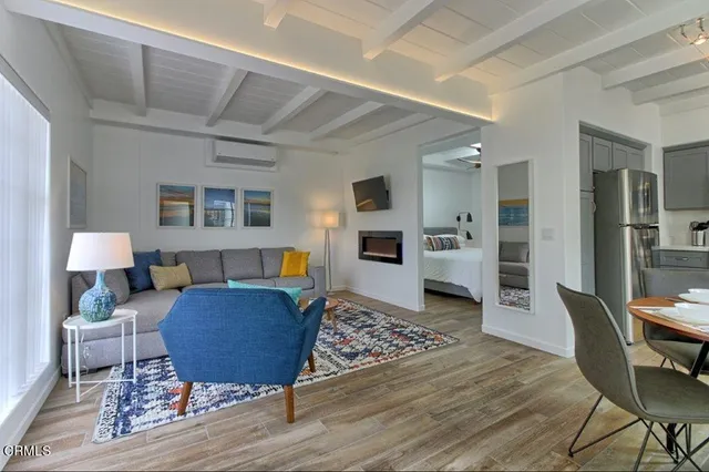 a living room with furniture and a rug
