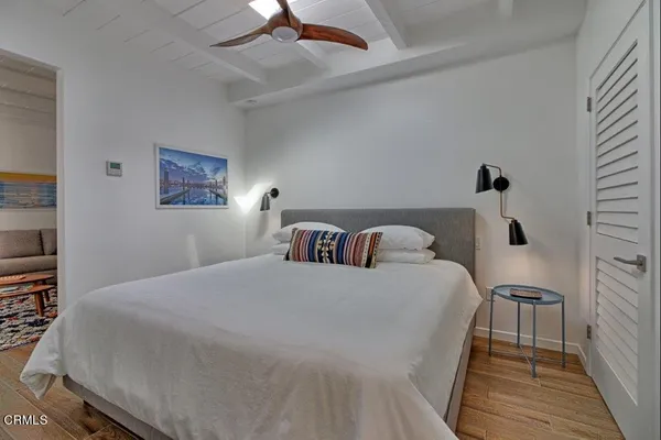 a bathroom with a double vanity sink a mirror and a shower
