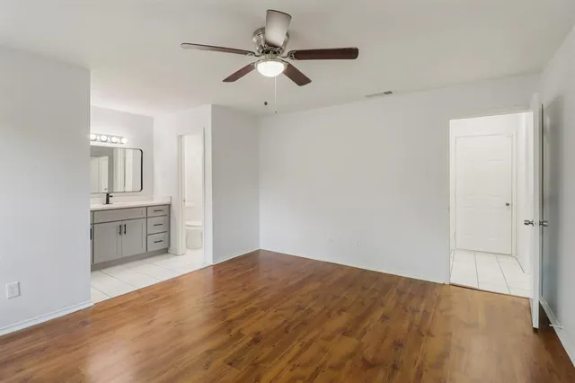 a view of a kitchen with a sink and cabinet