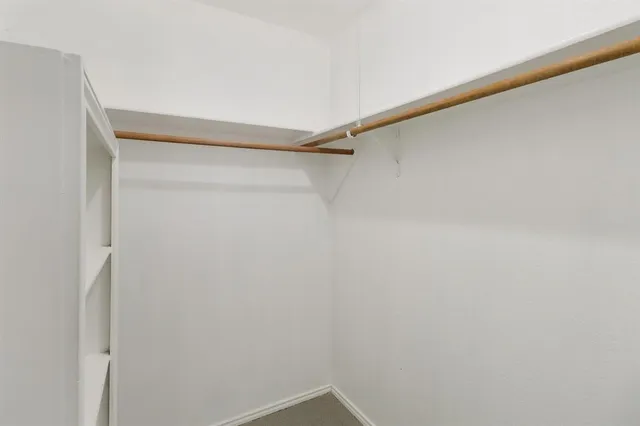 a view of a room with shelf on the wall
