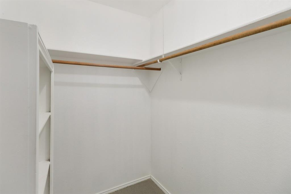 413 Chimney Rock Road Everman, TX 76140 - Photo 20 of 25 a view of a room with shelf on the wall