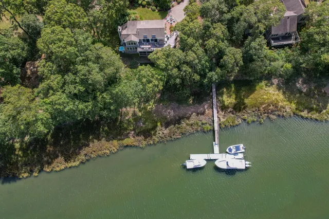 a view of a fire pit with large trees