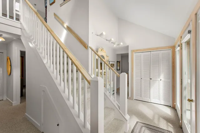 a view of staircase with lots of frames and walls