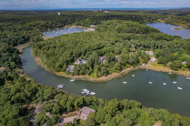 an aerial view of a house with a yard