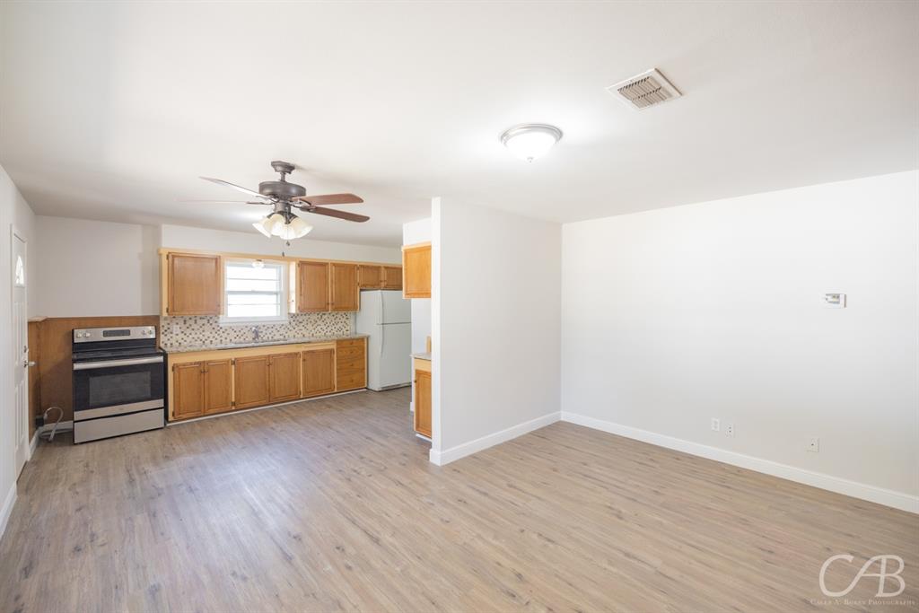 872 Forrest Avenue Abilene, TX 79603 - Photo 18 of 21 a view of kitchen and sink with wooden floor