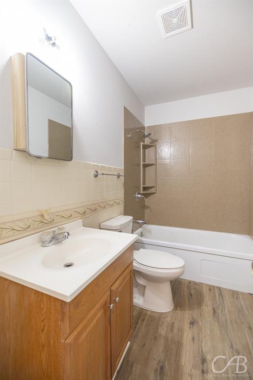 872 Forrest Avenue Abilene, TX 79603 - Photo 7 of 21 a bathroom with a sink a toilet and mirror
