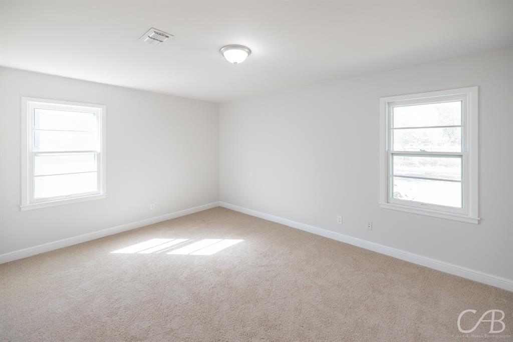 872 Forrest Avenue Abilene, TX 79603 - Photo 8 of 21 an empty room with a window