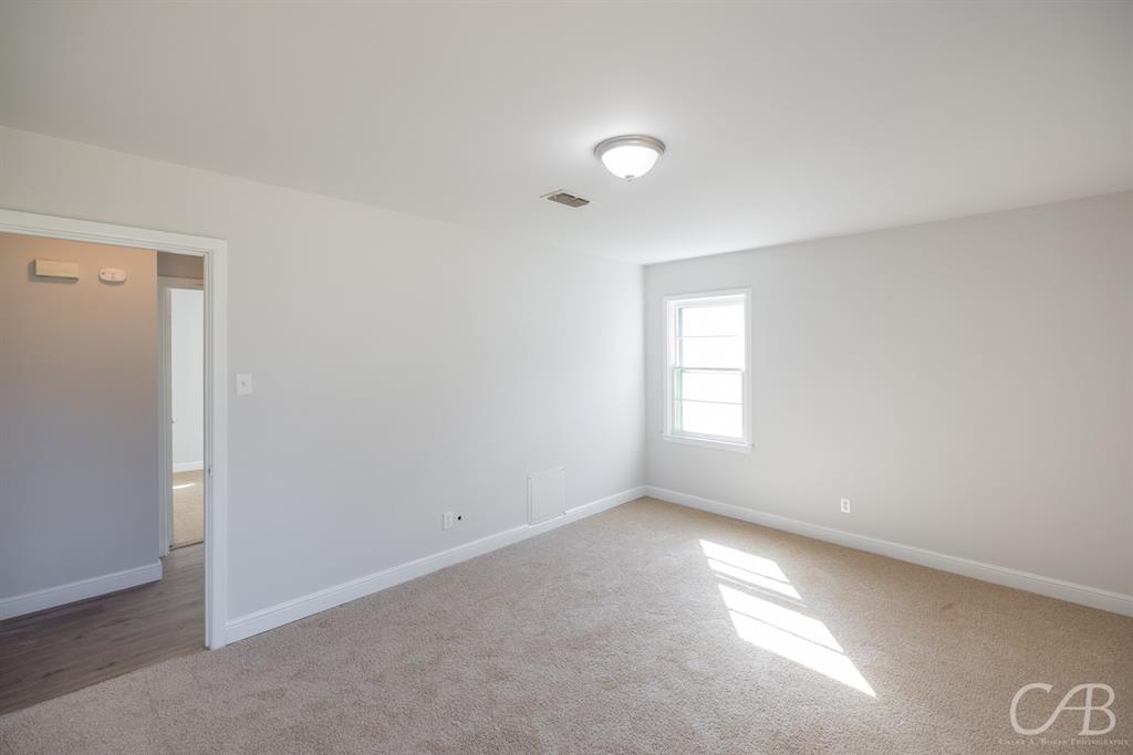 872 Forrest Avenue Abilene, TX 79603 - Photo 9 of 21 an empty room with a window