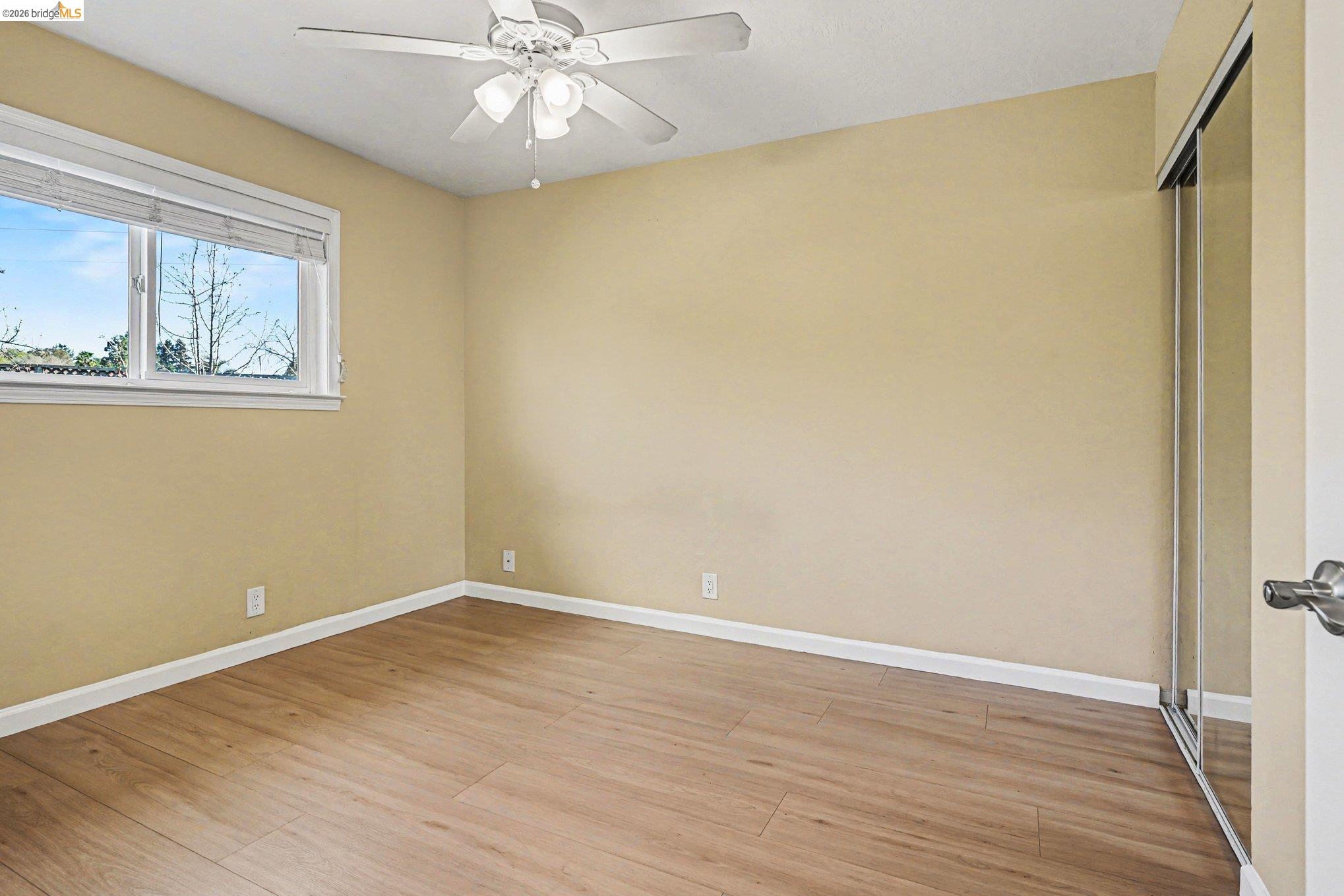 25 Marilyn Place San Ramon, CA 94583 - Photo 11 of 24 a view of an empty room with wooden floor and a window
