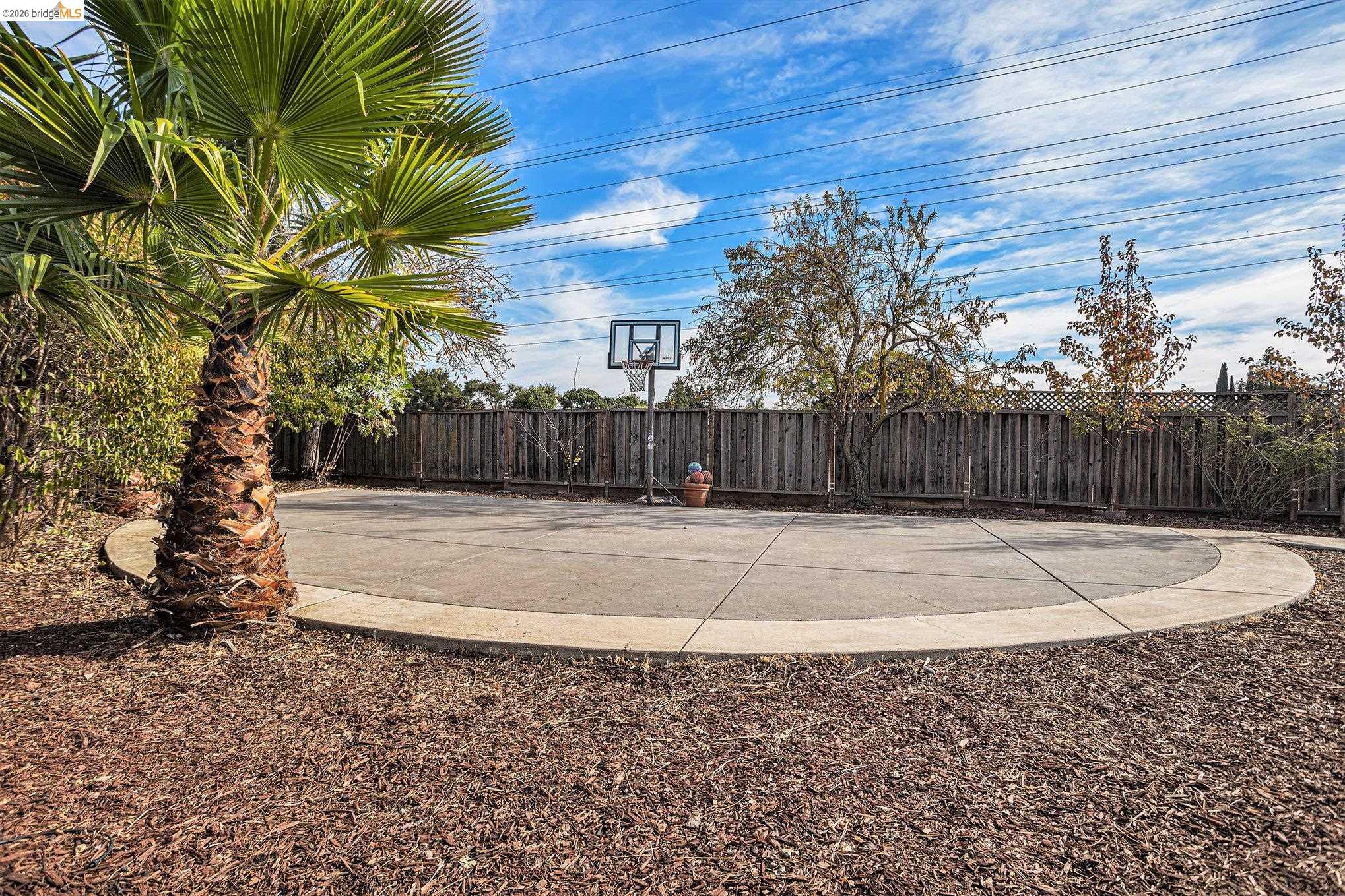 25 Marilyn Place San Ramon, CA 94583 - Photo 15 of 24 a view of a backyard with wooden fence